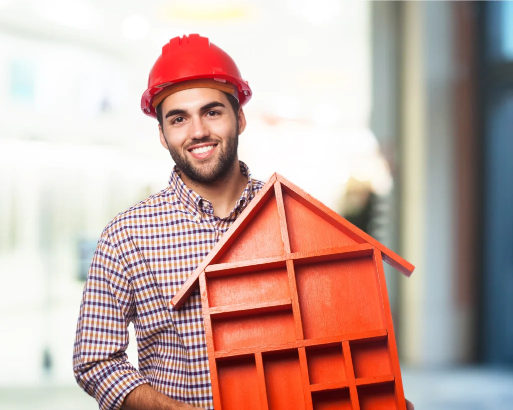 man-smiling-holding-house